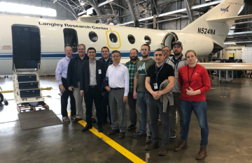 University of Arizona professors Xubin Zeng (fifth from left) and Armin Sorooshian (third from left) visited the LaRC in February 2019 to see the two aircraft that will be used for the project.