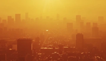 Hazy cityscape at sunset