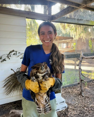 A photo of Angelina with an owl.