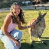 Angelina Terlizzi petting a kangaroo