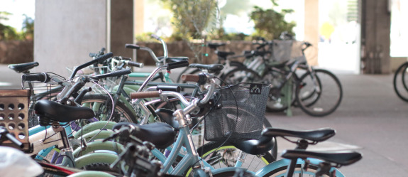Bikes parked and locked to racks on the University of Arizona campus