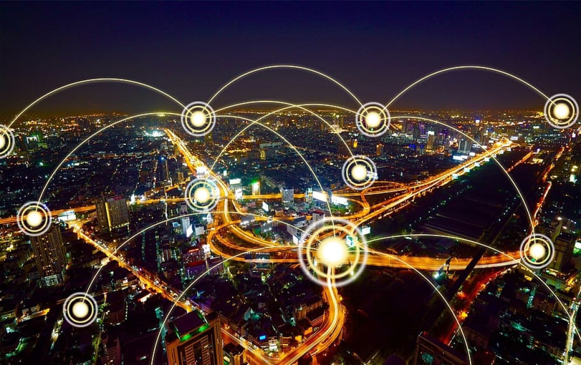 Network visualization on top of aerial city photo at night.